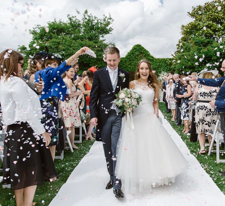 Confetti Moment | Bride in Pronovias | Groom in Moss Bros Suit | Elegant Notley Abbey Wedding | Natalie J Weddings Photography