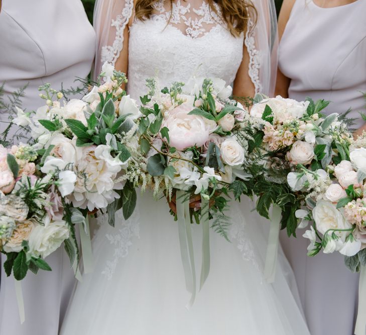 Romantic Blush Floral Bouquets | Bridesmaids in Taupe Dessy Dresses | Elegant Notley Abbey Wedding | Natalie J Weddings Photography