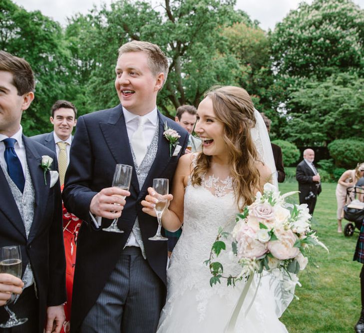 Bride in Pronovias Gown | Groom in Moss Bros Suit | Elegant Notley Abbey Wedding | Natalie J Weddings Photography