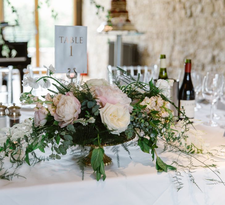 Romantic Pink Flower Centrepiece | Elegant Notley Abbey Wedding | Natalie J Weddings Photography