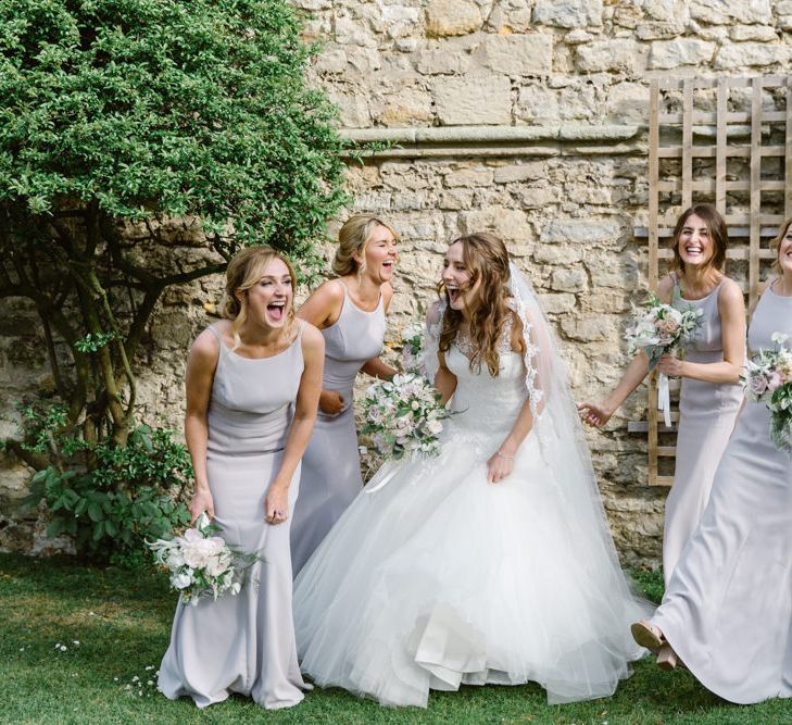 Bride in Pronovias Gown | Bridesmaids in Dessy Dresses | Elegant Notley Abbey Wedding | Natalie J Weddings Photography