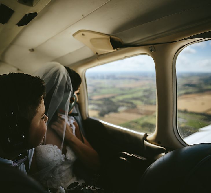 Bride Flying Into Wedding On A Plane