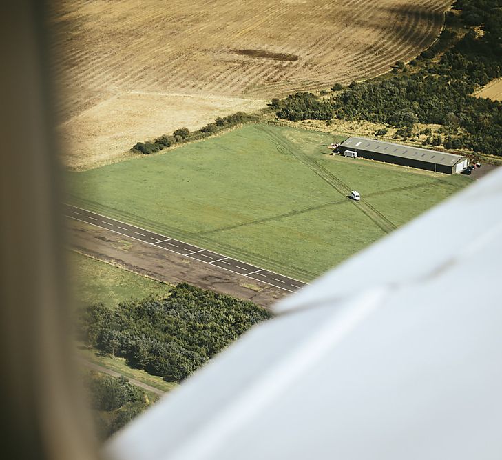 Bride Flying Into Wedding On A Plane