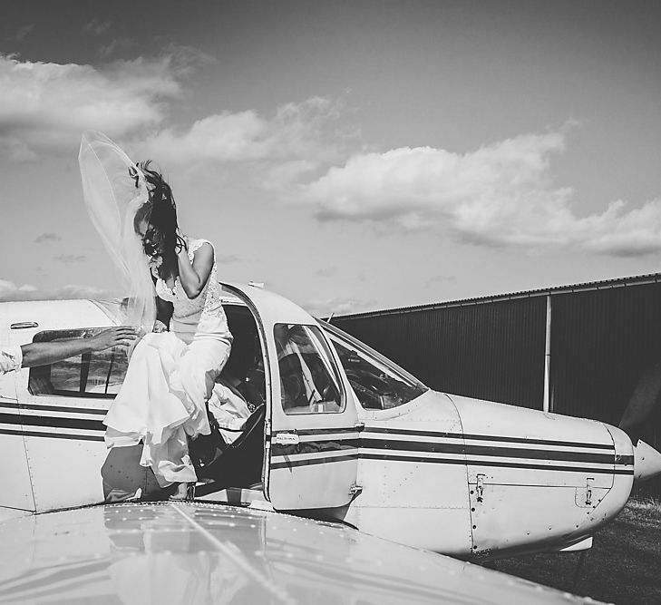 Bride Flying Into Wedding On A Plane