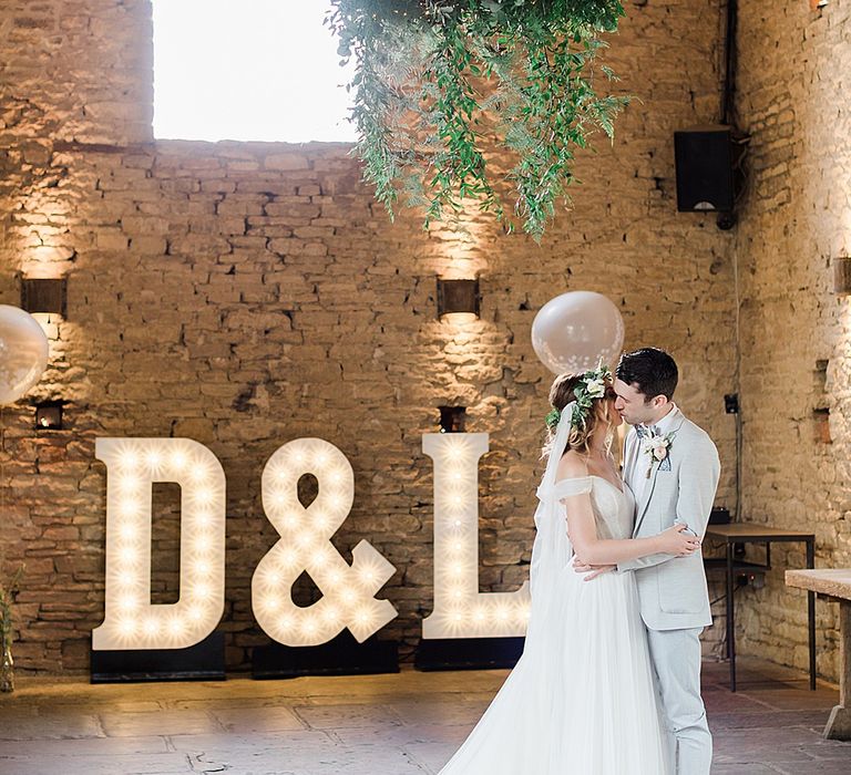 First Dance with Giant Light Up Letters | Bride in Heaton Wtoo by Watters Gown | Groom in ASOS Suit | Marble, Copper & Greenery Wedding at Cripps Barn Cotswolds | Summer Lily Studio Photography