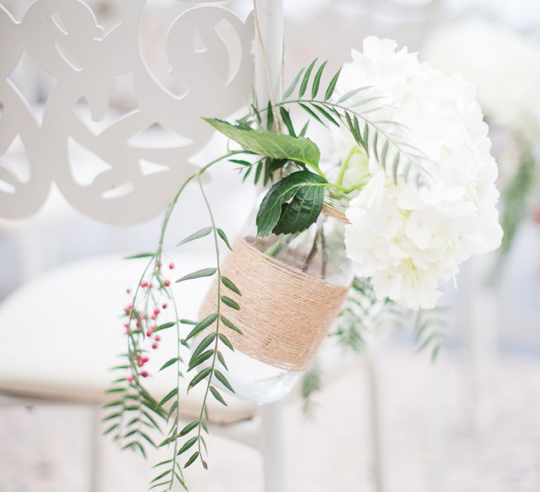 Aisle Chair Back Decor | Flowers in Jars | Intimate Outdoor Destination Wedding at Kinsterna Hotel & Spa in Greece | Cecelina Photography