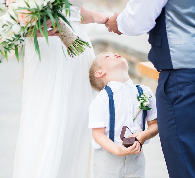 Page Boy in Shorts & Braces | Intimate Outdoor Destination Wedding at Kinsterna Hotel & Spa in Greece | Cecelina Photography