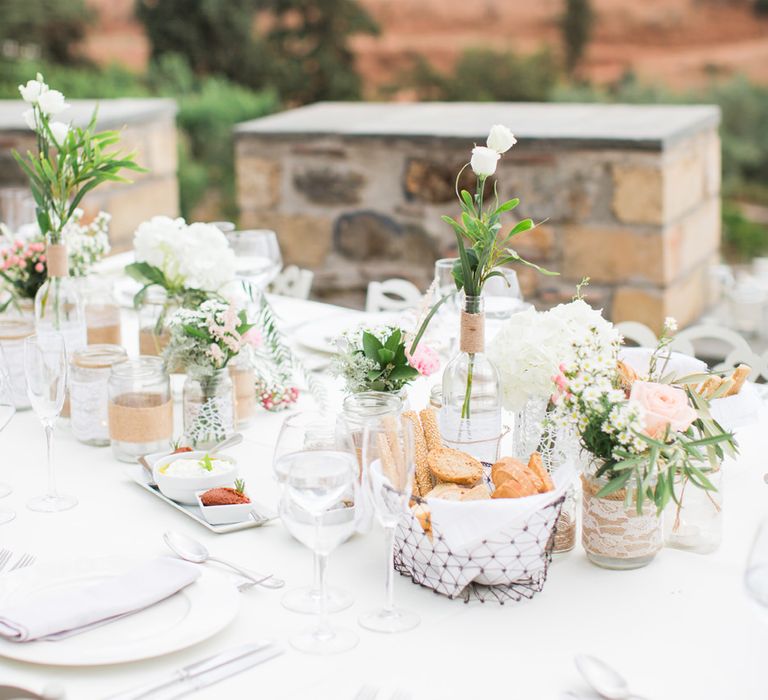 Jars & Bottles filled with Flower Stems | Wedding Decor | Intimate Outdoor Destination Wedding at Kinsterna Hotel & Spa in Greece | Cecelina Photography