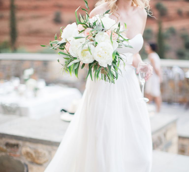 Bride in BHLDN Gown with White & Peach Bouquet | Intimate Outdoor Destination Wedding at Kinsterna Hotel & Spa in Greece | Cecelina Photography