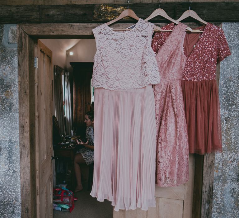 Pink Highstreet Bridesmaid Dresses | Coral Wedding Cake with Peony Decor | Bride in Anna Campbell Gown from Coco & Kate Boutique | Groom in Next Wool Suit | Rustic Barn Pink Summer Wedding at Nancarrow Farm in Cornwall | Ross Talling Photography