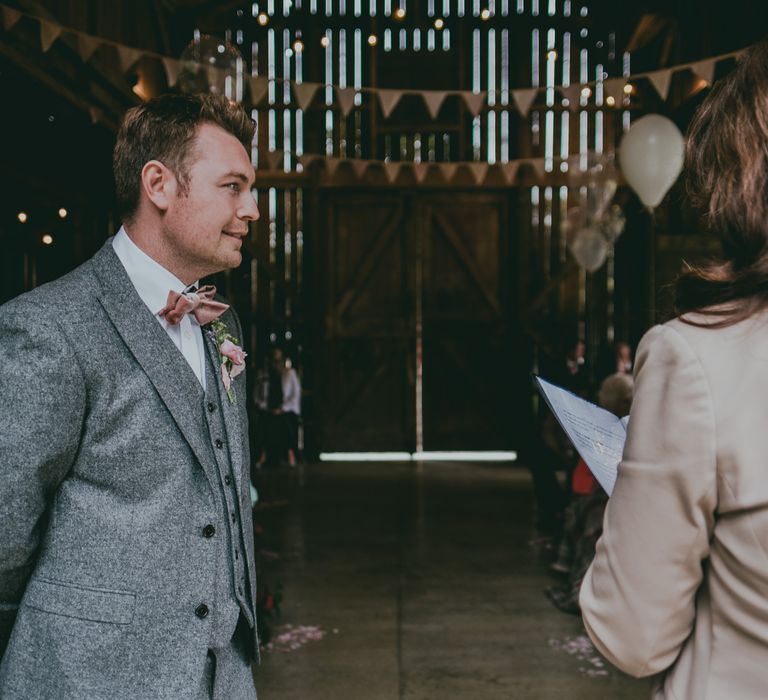 Groom in Grey Wool Next Suit | Coral Wedding Cake with Peony Decor | Bride in Anna Campbell Gown from Coco & Kate Boutique | Groom in Next Wool Suit | Rustic Barn Pink Summer Wedding at Nancarrow Farm in Cornwall | Ross Talling Photography