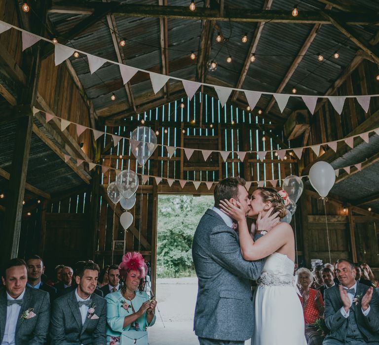 Wedding Ceremony | Bride in Anna Campbell Gown | Groom in Grey Wool Suit | Coral Wedding Cake with Peony Decor | Bride in Anna Campbell Gown from Coco & Kate Boutique | Groom in Next Wool Suit | Rustic Barn Pink Summer Wedding at Nancarrow Farm in Cornwall | Ross Talling Photography