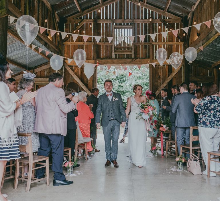 Wedding Ceremony | Liberty Print bunting | Balloon Decor | Bride in Anna Campbell Gown | Groom in Grey Wool Suit | Coral Wedding Cake with Peony Decor | Bride in Anna Campbell Gown from Coco & Kate Boutique | Groom in Next Wool Suit | Rustic Barn Pink Summer Wedding at Nancarrow Farm in Cornwall | Ross Talling Photography