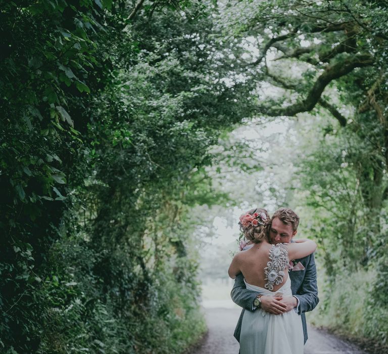 Bride in Anna Campbell Gown from Coco & Kate Boutique | Groom in Next Wool Suit | Rustic Barn Pink Summer Wedding at Nancarrow Farm in Cornwall | Ross Talling Photography