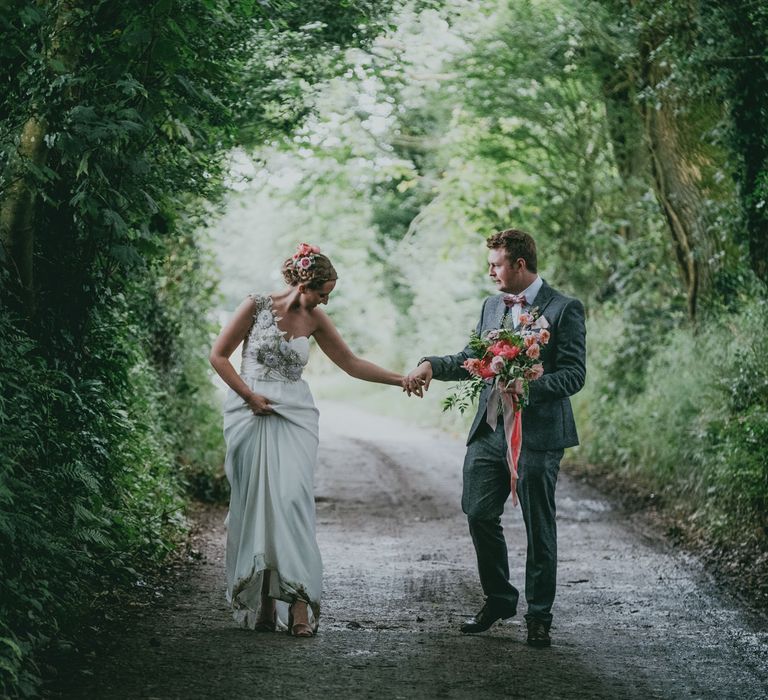 Bride in Anna Campbell Gown from Coco & Kate Boutique | Groom in Next Wool Suit | Rustic Barn Pink Summer Wedding at Nancarrow Farm in Cornwall | Ross Talling Photography