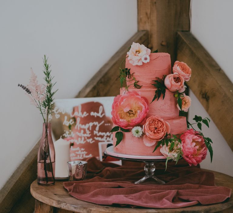 Coral Wedding Cake with Peony Decor | Bride in Anna Campbell Gown from Coco & Kate Boutique | Groom in Next Wool Suit | Rustic Barn Pink Summer Wedding at Nancarrow Farm in Cornwall | Ross Talling Photography