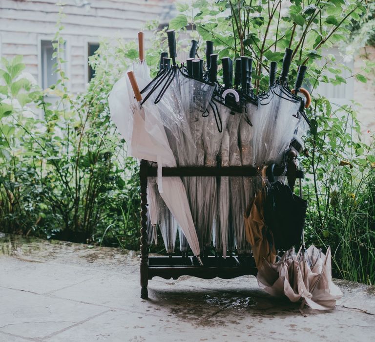 Umberellas | Bride in Anna Campbell Gown from Coco & Kate Boutique | Groom in Next Wool Suit | Rustic Barn Pink Summer Wedding at Nancarrow Farm in Cornwall | Ross Talling Photography