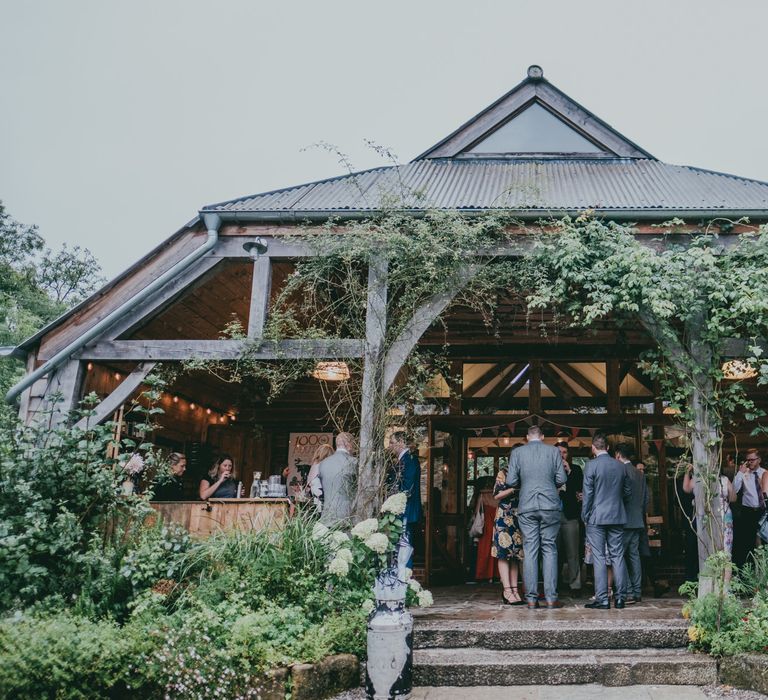 Bride in Anna Campbell Gown from Coco & Kate Boutique | Groom in Next Wool Suit | Rustic Barn Pink Summer Wedding at Nancarrow Farm in Cornwall | Ross Talling Photography