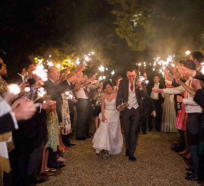 Sparkler Exit | Bride in Renee L. Collections Gown | Groom in Moss Bros Traditional Suit | Jacob & Pauline Photography | Pretty in White Films