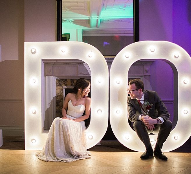 Vowed & Amazed I Do Giant Marquee Lights | Bride in Renee L. Collections Gown | Groom in Moss Bros Traditional Suit | Jacob & Pauline Photography | Pretty in White Films