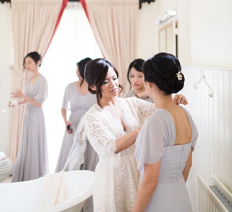 Getting Ready | Bride in Renee L. Collections Gown | Bridesmaids in Grey Love Potion Dresses | Jacob & Pauline Photography | Pretty in White Films