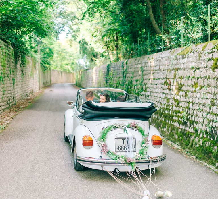 White Beetle Wedding Car with Tin Cans