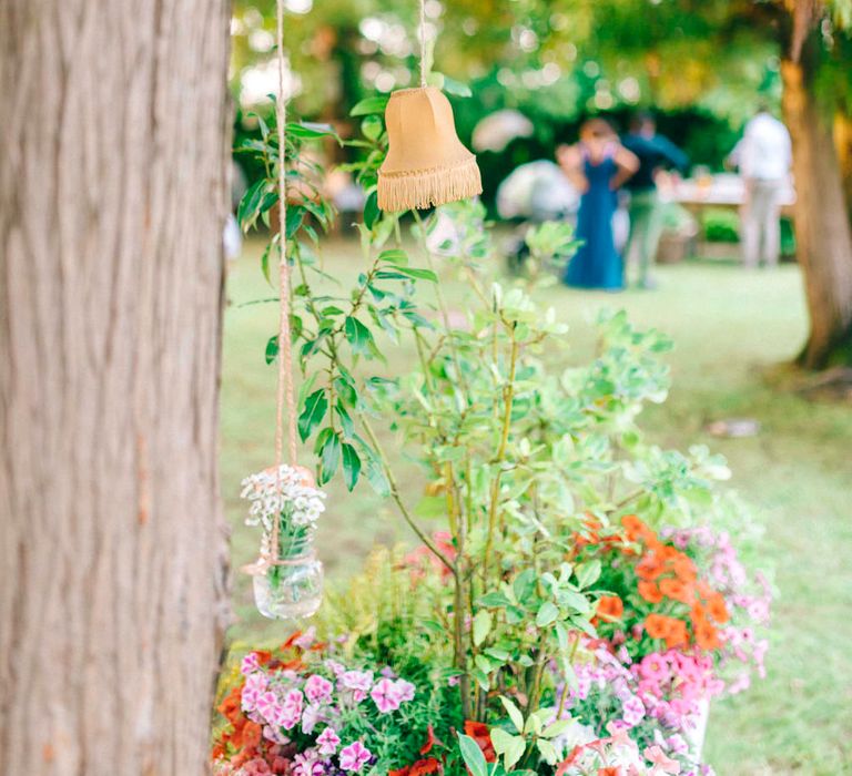 Hanging Lamp Shades & Bottles with Flowers