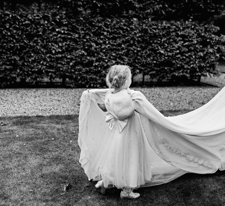 Flower Girl With Bride In Pronovias Image by Steve Gerrard Photography