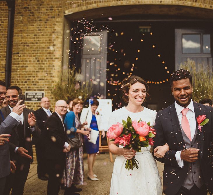 Confetti Moment | Bride in Ted Baker Separates | Groom in Hugo Boss | Tropical Trinity Buoy Wharf Wedding | Matt Penberthy Photography