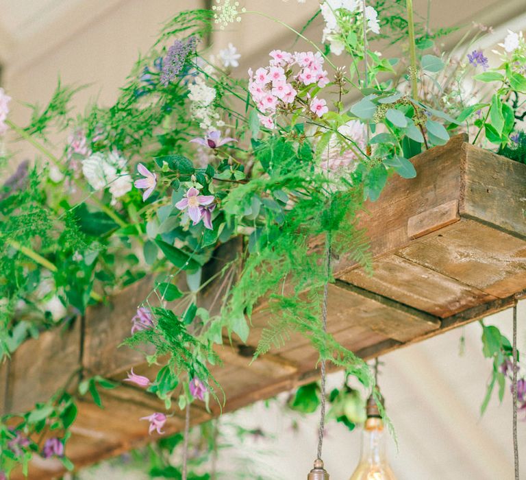 Edison Bulb Light Installation With Flowers