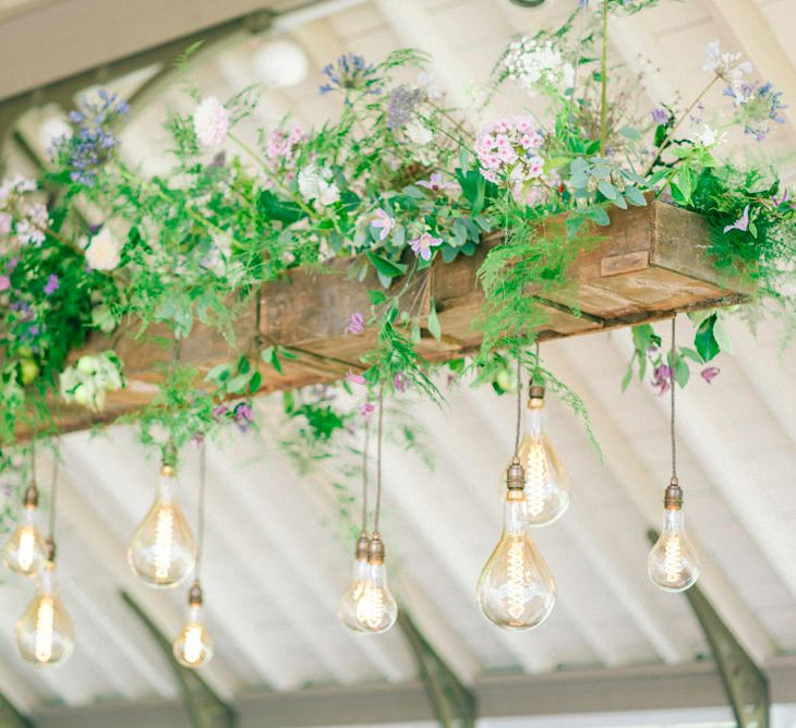 Edison Bulb Light Installation With Flowers