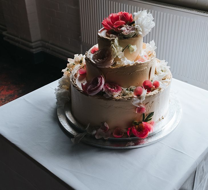 Buttercream Wedding Cake With Fresh Flowers // Image by Miss Gen Photography