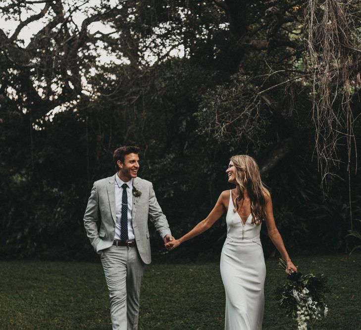 Bride in Bespoke Julia Ferrandi Backless Wedding Gown | Groom in Grey Woolworth Suit | Outdoor Woodland Wedding in South Africa | Michigan Behn Photography