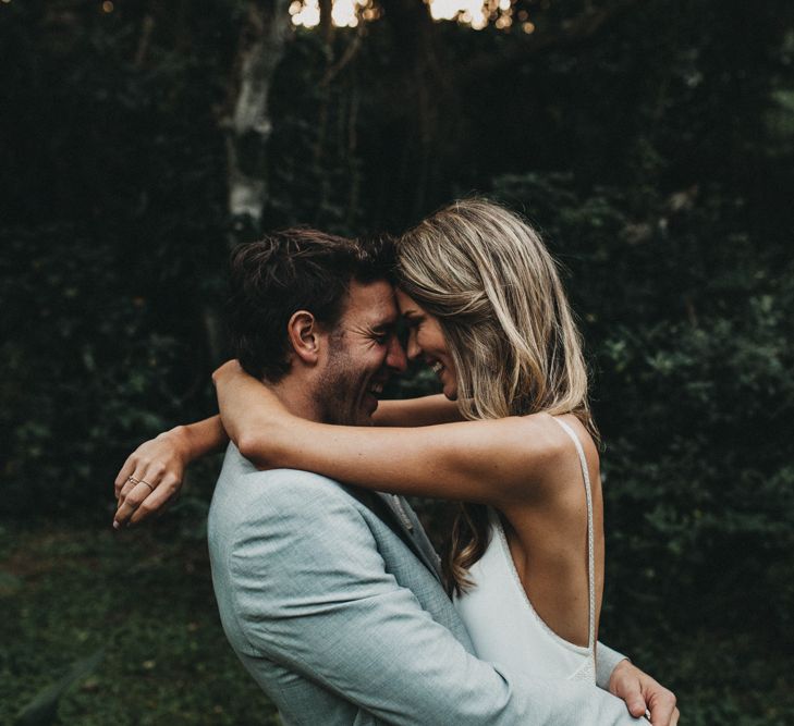 Bride in Bespoke Julia Ferrandi Backless Wedding Gown | Groom in Grey Woolworth Suit | Outdoor Woodland Wedding in South Africa | Michigan Behn Photography