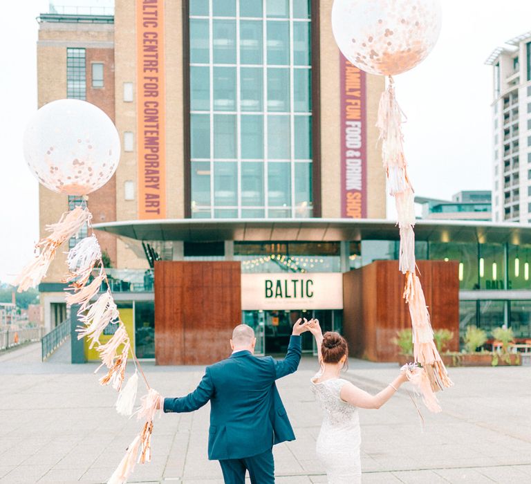 Giant Balloons & Tassels Bride & Groom Portrait