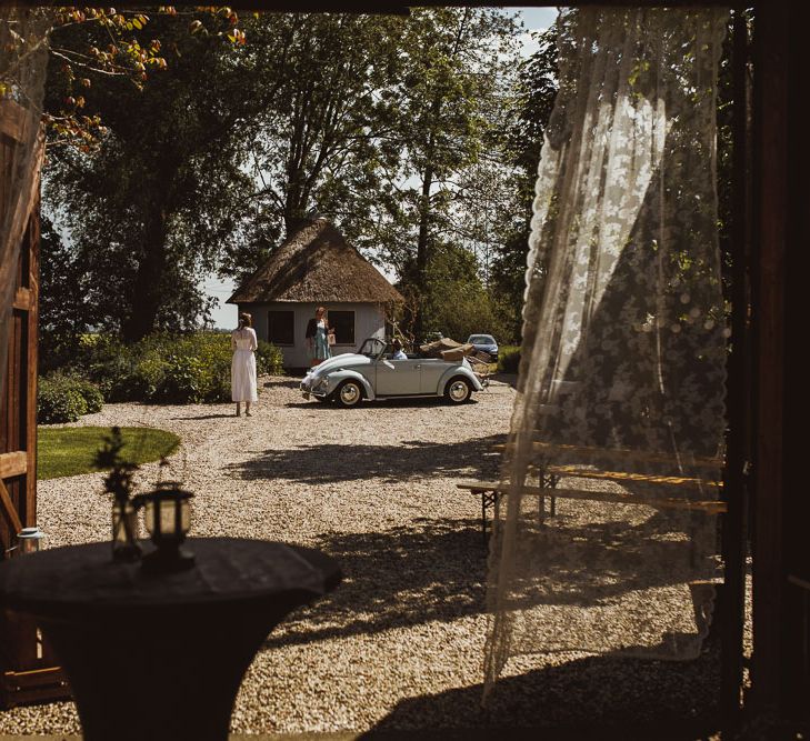 Rustic DIY Wedding In The Netherlands With Bride In Tea Length Vintage Gown And Images From Neil Jackson Photographic With Vintage Mint Green VW Beetle