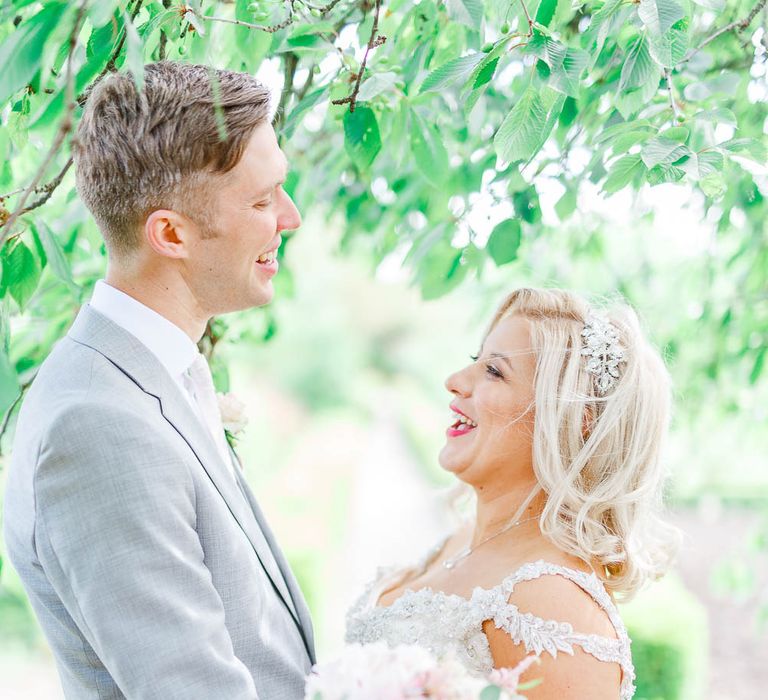 Bride in Sottero & Midgley Marigold Dress | Groom in Light Grey Reiss Suit | The Secret Garden Wedding Venue in Essex | White Stag Wedding Photography