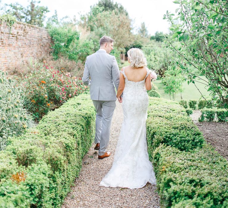 Bride in Sottero & Midgley Marigold Dress | Groom in Light Grey Reiss Suit | The Secret Garden Wedding Venue in Essex | White Stag Wedding Photography