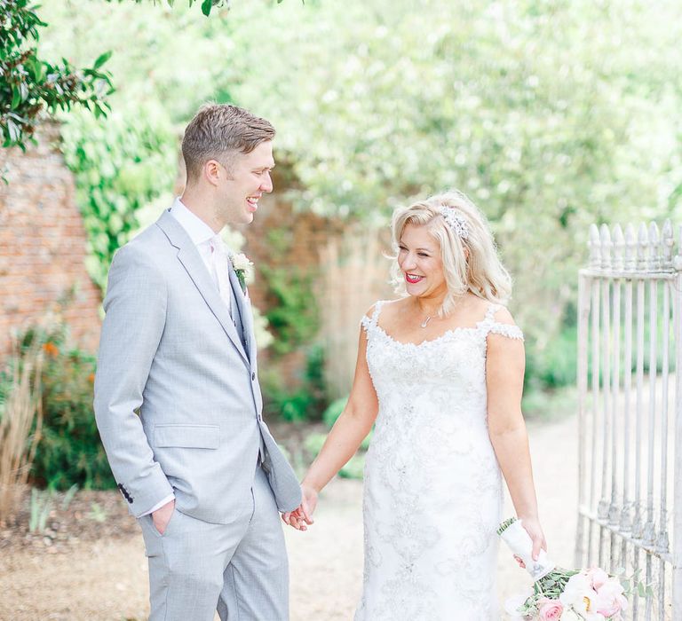 Bride in Sottero & Midgley Marigold Dress | Groom in Light Grey Reiss Suit | The Secret Garden Wedding Venue in Essex | White Stag Wedding Photography