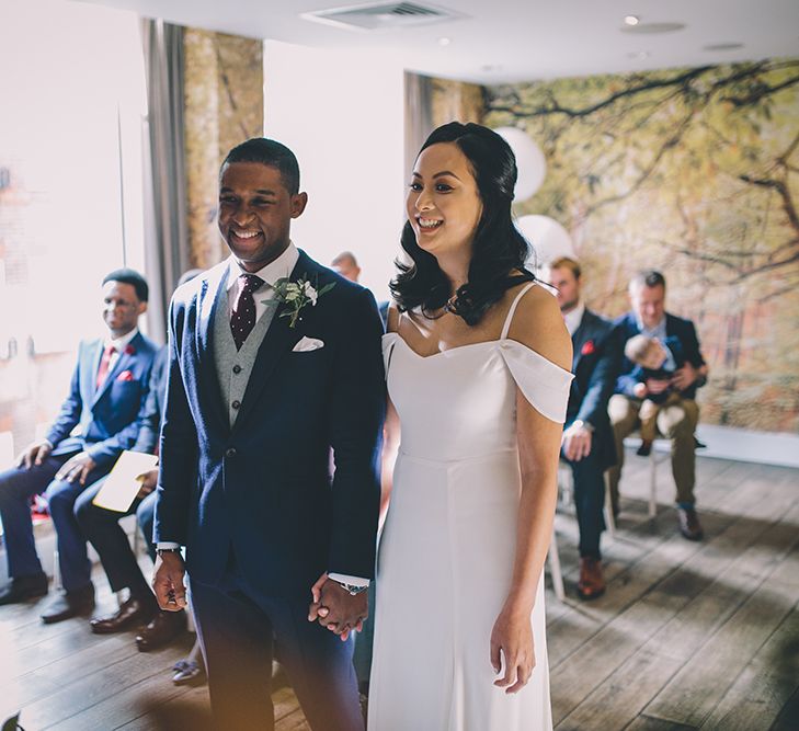 Wedding Ceremony | Bride in Reformation Poppy Gown | Groom in Navy Bespoke Club Suit | Stylish London Wedding Planned by Revelry Events | Story + Colour Photography