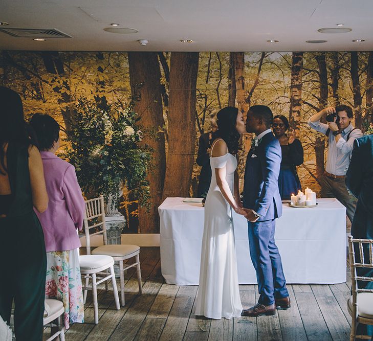 Wedding Ceremony | Bride in Reformation Poppy Gown | Groom in Navy Bespoke Club Suit | Stylish London Wedding Planned by Revelry Events | Story + Colour Photography