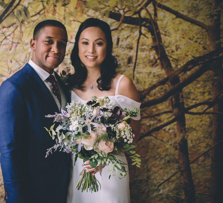 Wedding Ceremony | Bride in Reformation Poppy Gown | Groom in Navy Bespoke Club Suit | Stylish London Wedding Planned by Revelry Events | Story + Colour Photography