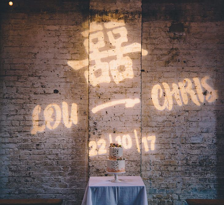 Personalised Light Projection | Stylish London Wedding Planned by Revelry Events | Story + Colour Photography