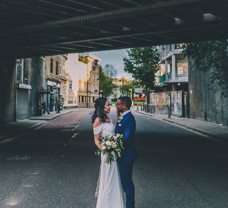 Bride in Reformation Poppy Gown | Groom in Tailored The Bespoke Club Navy Suit | Stylish London Wedding Planned by Revelry Events | Story + Colour Photography