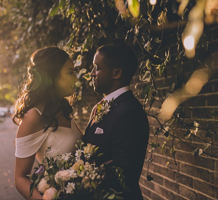 Bride in Reformation Poppy Gown | Groom in Tailored The Bespoke Club Navy Suit | Stylish London Wedding Planned by Revelry Events | Story + Colour Photography