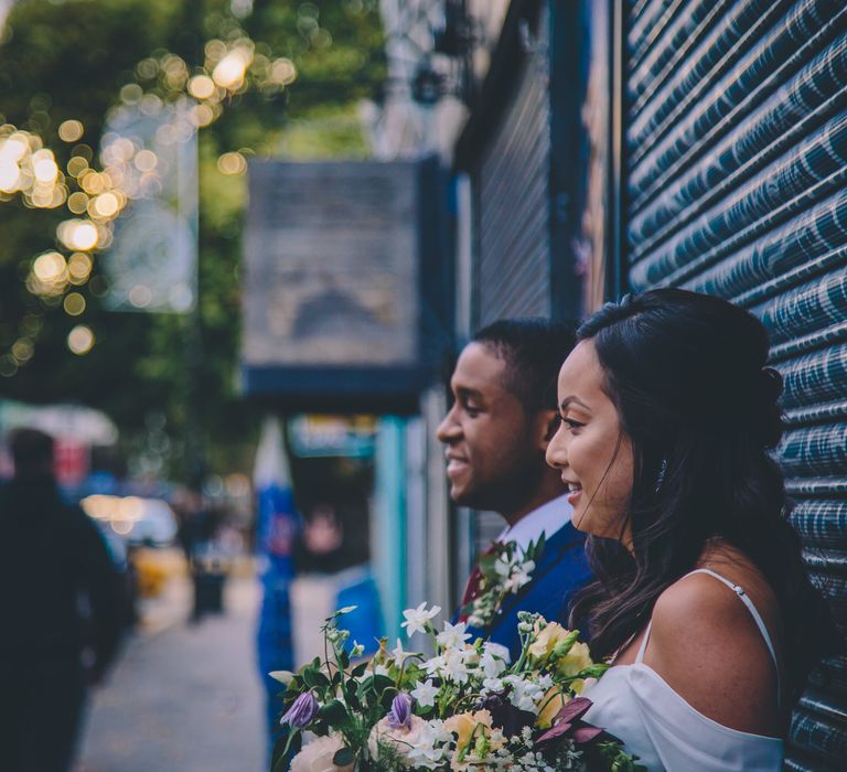 Bride in Reformation Poppy Gown | Groom in Tailored The Bespoke Club Navy Suit | Stylish London Wedding Planned by Revelry Events | Story + Colour Photography