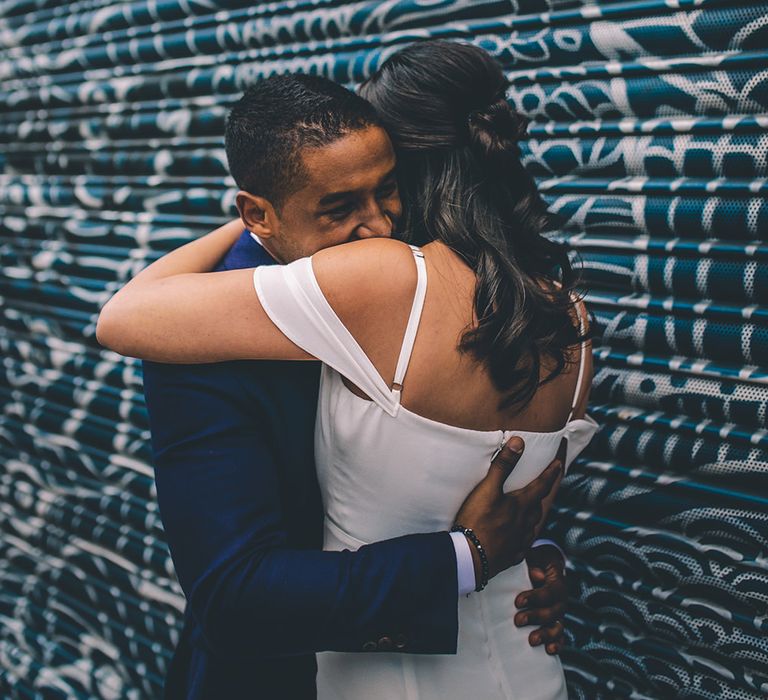 Bride in Reformation Poppy Gown | Groom in Tailored The Bespoke Club Navy Suit | Stylish London Wedding Planned by Revelry Events | Story + Colour Photography