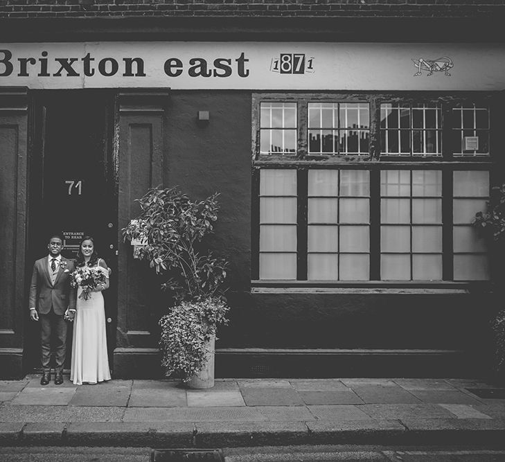 Bride in Reformation Poppy Gown | Groom in Tailored The Bespoke Club Navy Suit | Stylish London Wedding Planned by Revelry Events | Story + Colour Photography