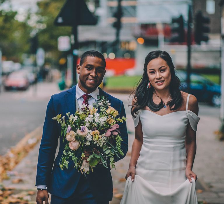 Bride in Reformation Poppy Gown | Groom in Tailored The Bespoke Club Navy Suit | Stylish London Wedding Planned by Revelry Events | Story + Colour Photography