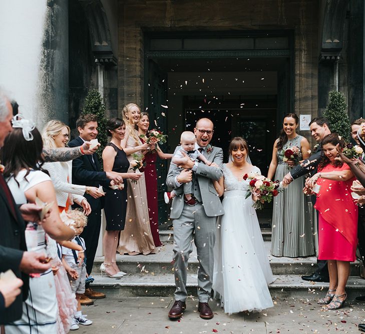 Confetti Moment | Bride in Cymbeline Wedding Dress | Groom in Bailey Nelson Suit | Laid Back Pub Wedding at The Londesborough | Miss Gen Photography